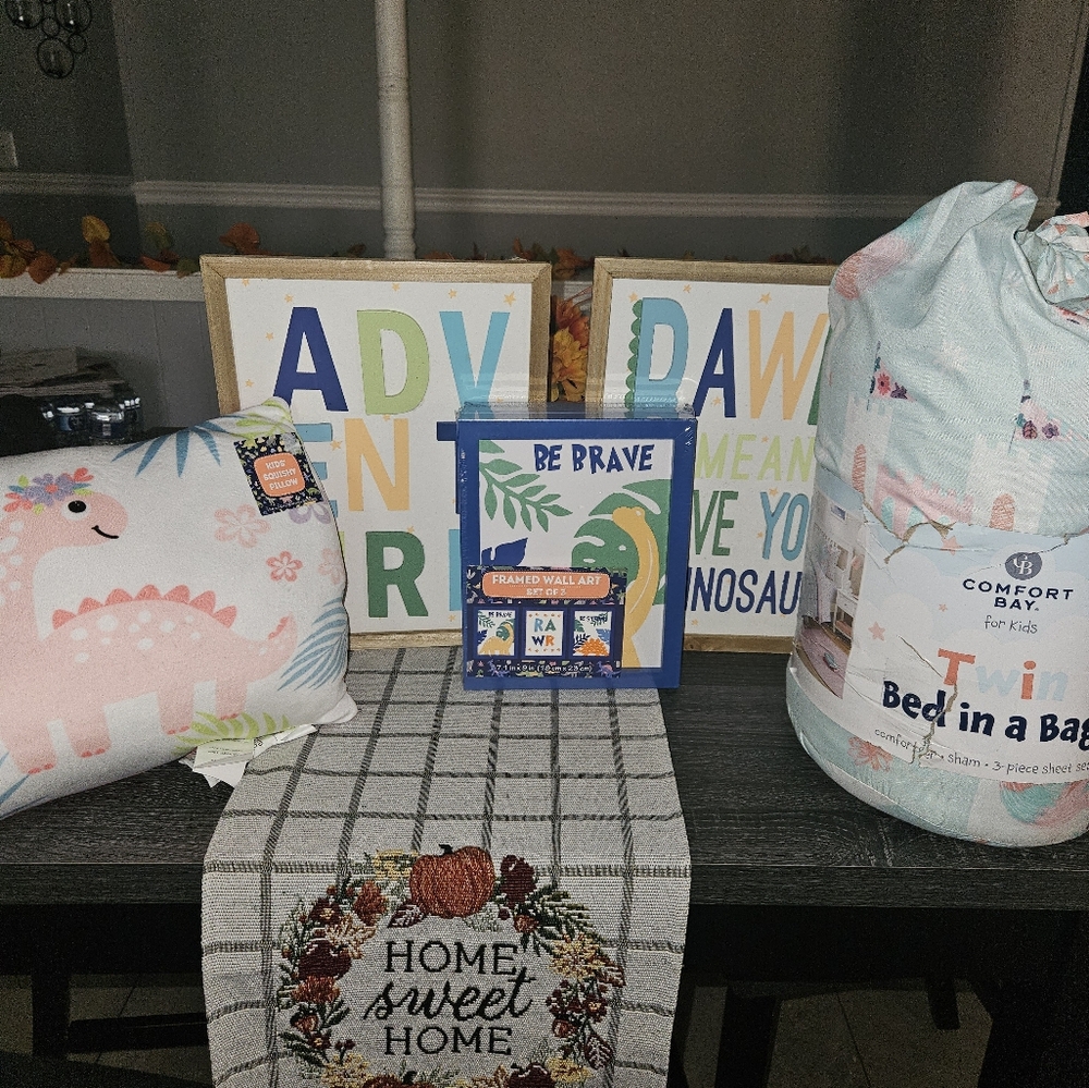 Twin bed in a bag with wall pictures and pillow